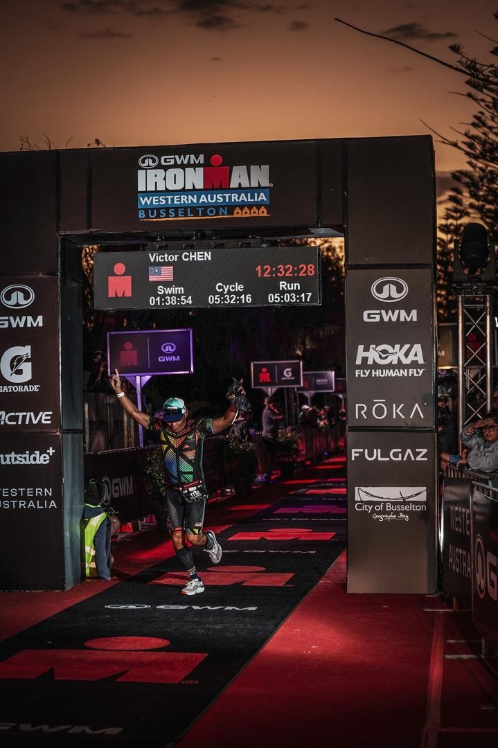 Dr. Victor Chen crossing the Ironman Western Australia finish line in Busselton